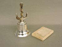 Lot 144 - A metal bell with anchor