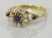 Lot 6 - A sapphire and diamond circular cluster ring