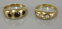 Lot 21 - A gentleman's three stone garnet ring