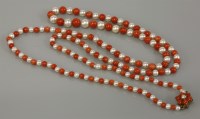 Lot 11 - A single row graduated cultured pearl and coral necklace