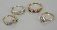 Lot 25 - A 9ct gold three stone ruby ring