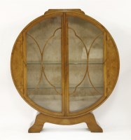 Lot 234 - An Art Deco walnut circular display cabinet
