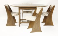 Lot 122 - An oak dining table and four chairs