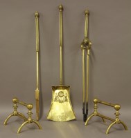 Lot 65 - A set of three Arts and Crafts brass fire tools