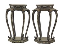 Lot 576 - A pair of large lacquered urn stands