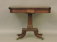 Lot 391 - A Regency period brass inlaid rosewood foldover top card table