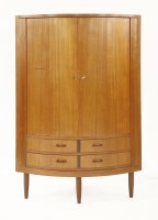 Lot 366 - A Danish teak corner cabinet