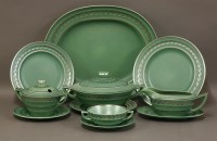 Lot 127 - A Wedgwood green pottery dinner service