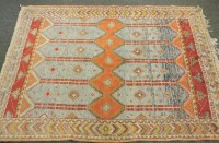 Lot 457 - A Caucasian orange ground carpet