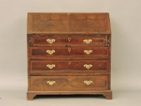 Lot 367 - A George III walnut and crossbanded bureau