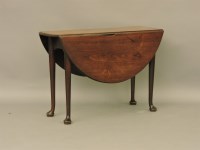 Lot 467 - A Georgian mahogany drop leaf table