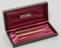 Lot 29 - A cased Sheaffer gold plated three piece pen set