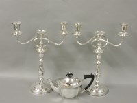 Lot 122 - A pair of silver plated three branch candelabra