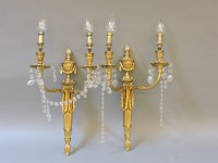 Lot 133A - A pair of early 20th century gilt metal two branch wall lights