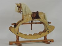 Lot 489 - A large stripped pine rocking horse