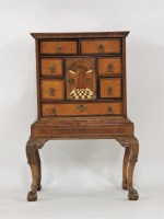 Lot 491 - A 19th century Continental walnut cabinet and stand