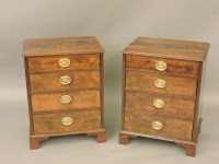 Lot 472 - A pair of mahogany bedside four drawer chests