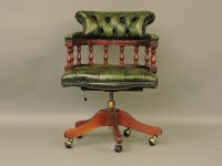 Lot 394 - A green leather button back strung mahogany desk chair