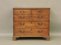 Lot 384 - A George III mahogany chest of two short and three long drawers