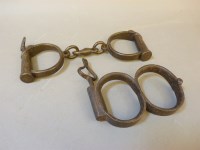Lot 117 - A pair of 19th century figure '8' police handcuffs