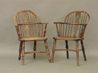 Lot 451 - Two similar early 19th century elm seated Windsor chairs