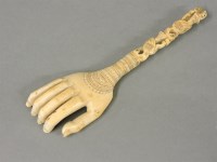 Lot 60 - A late 19th century Indian carved ivory back scratcher