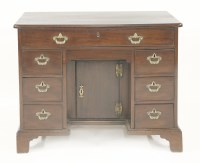 Lot 445 - A George II mahogany kneehole desk