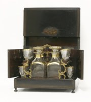 Lot 74 - A French ebonised and brass inlaid tantalus box