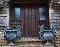 Lot 183 - A pair of bronze urns