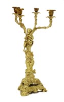 Lot 529 - A gilt bronze four-branch candelabra