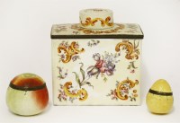 Lot 104 - An enamel tea caddy and cover