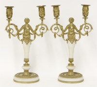 Lot 138 - A pair of French gilt bronze and alabaster-mounted twin-branch candelabra