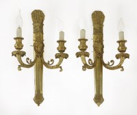 Lot 476 - A pair of bronze twin branch wall lights