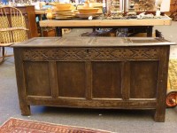 Lot 524 - A 17th century oak four panel coffer