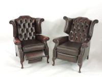 Lot 388 - A pair of leather button back reclining armchairs