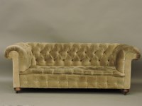 Lot 400 - A green buttoned Chesterfield settee