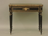 Lot 379 - An early 19th century ebonised and boulle foldover top card table