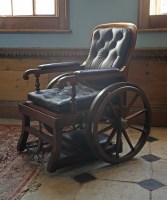 Lot 398 - A mahogany and brass invalid chair