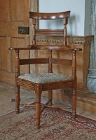 Lot 399 - An unusual mahogany corner chair