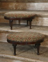 Lot 414 - A pair of needlepoint oval shaped foot stools