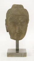 Lot 22 - A Thai carved sandstone head of Buddha