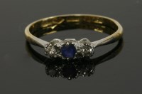 Lot 179 - A three stone sapphire and diamond ring