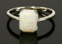 Lot 180 - A white gold single stone opal ring