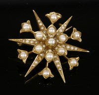 Lot 181 - A late Victorian gold split pearl starburst brooch/pendant