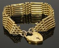 Lot 204 - A six row gold gate bracelet by Lawson