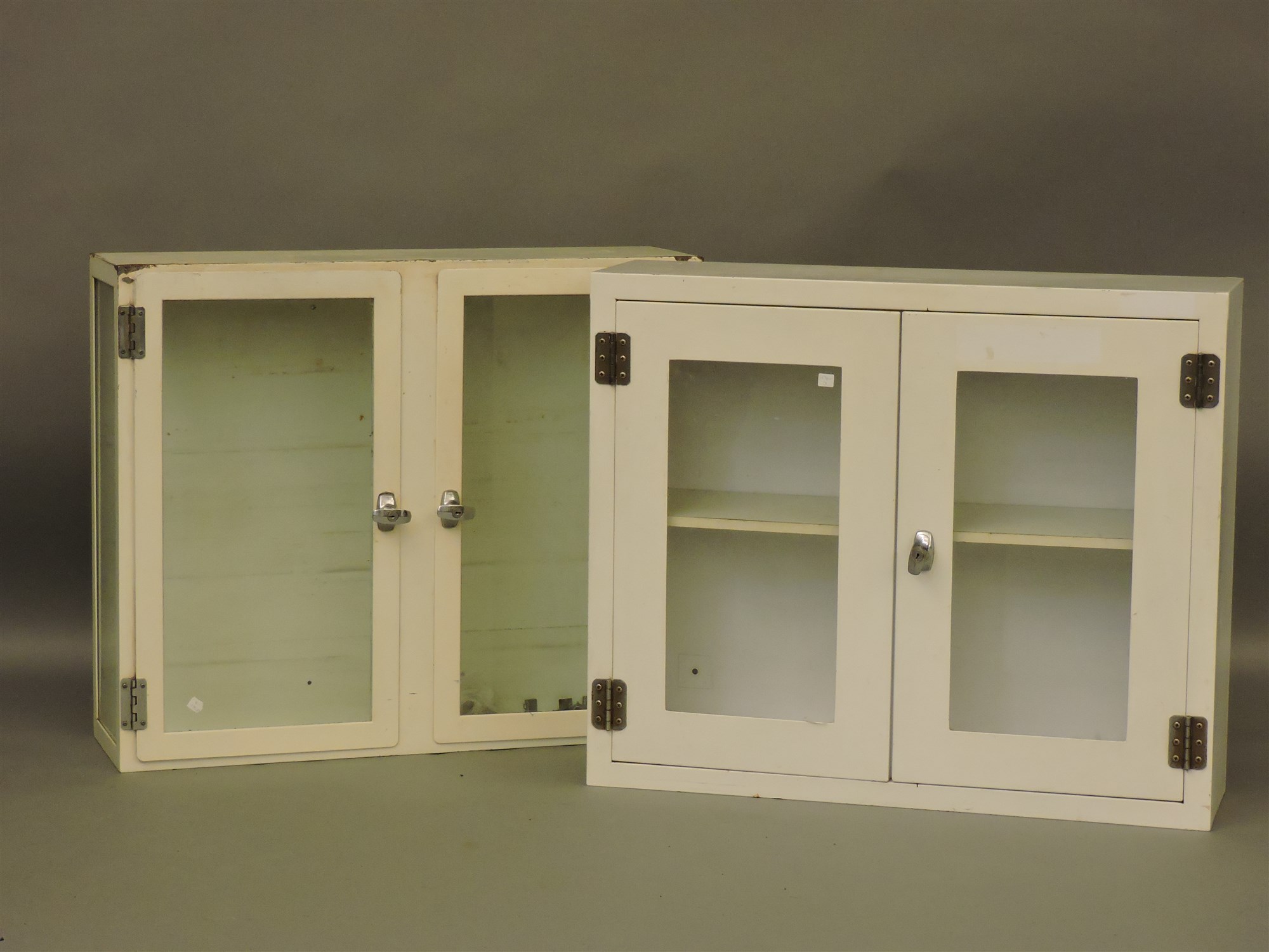 Lot 714 Two Glazed White Painted Steel Cabinets