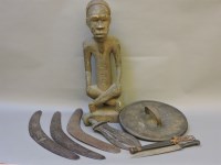 Lot 366 - A carved wooden African figure of a cross-legged fellow