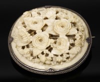 Lot 200 - A Victorian carved and pierced ivory brooch