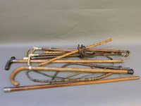 Lot 353 - A collection of various walking sticks and crops