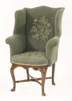 Lot 513 - A Georgian wing armchair